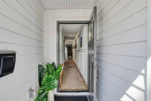 an open door to a hallway of a house at Lincolnville Nook in St. Augustine