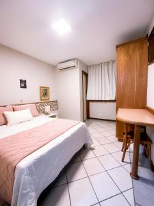 Postel nebo postele na pokoji v ubytování Porty Brasil Hotel