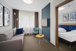 Posteľ alebo postele v izbe v ubytovaní Hotel Halo Toruń