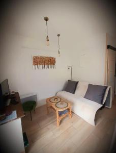a small bedroom with a bed and a table at La casa d'isa in Ducey +3 photos