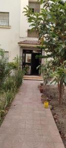 a walkway in front of a building with a door at Appartement Tanger Lux in Tangier