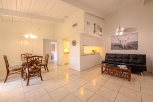 a living room with a couch and a table at Spoonbills Sanctuary Coastal Chic 1BR Retreat 329 in South Padre Island
