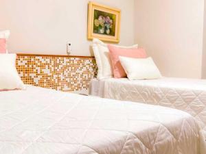 Postel nebo postele na pokoji v ubytování Porty Brasil Hotel