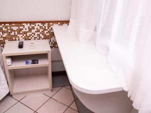 Postel nebo postele na pokoji v ubytování Porty Brasil Hotel