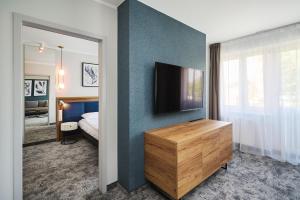 TV a/nebo společenská místnost v ubytování Hotel Halo Toruń