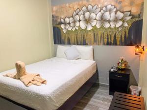 Ένα ή περισσότερα κρεβάτια σε δωμάτιο στο Mi Tierra Aeropuerto SAL Hotel y Restaurante