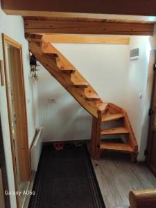 a loft bed in a tiny house at Bungalows Ivan in Žabljak +35 photos