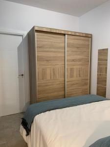 Ένα ή περισσότερα κρεβάτια σε δωμάτιο στο Apartamento Isaac