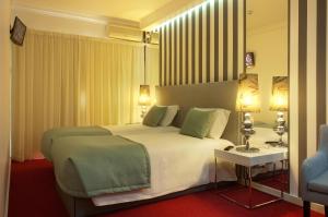 Postel nebo postele na pokoji v ubytování Hotel Lagoa dos Pastorinhos