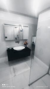 a bathroom with a sink and a mirror at Villamuz in Yalıkavak +88 photos
