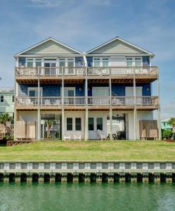 a large house on the water at Ripkens Retreat in Surf City