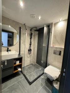 a bathroom with a shower and a sink at SkyLife OldCity Hotel in Istanbul