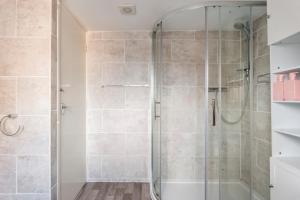 a shower with a glass door in a bathroom at The Hideaway, lovely cosy place in Blandford Forum, Dorset in Blandford Forum