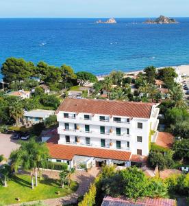 an aerial view of a hotel and the ocean at Hotel Mediterraneo in Santa Maria Navarrese