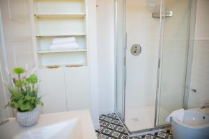a bathroom with a shower and a sink at Villa Egle Perugia in Cenerente +51 photos