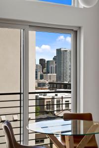 a view of a city skyline from a window at Modern Lifestyle Loft with View - Zuni Lofts in Denver