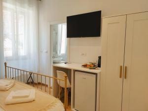 TV a/nebo společenská místnost v ubytování Papavero rooms
