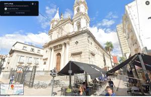 a large white building with a clock tower at Departamento en PEATONAL con SEGURIDAD privada 24hs in Santa Fe