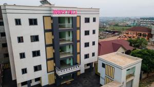 an overhead view of a building with a pink sign on it at Eden's Villa in Kumasi