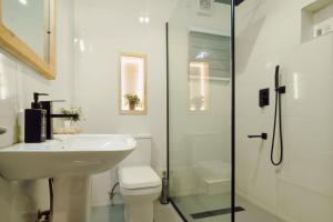 a bathroom with a sink and a toilet and a shower at 3 bedroom Greys Apartment Lifecamp Abuja in Tungan Daudu +18 photos