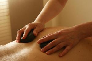a man getting a massage from a therapist at Hotel Casa Ecuatreasures Centro Historico in Quito
