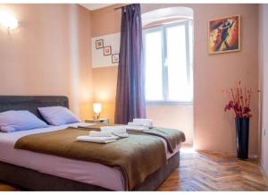 Postel nebo postele na pokoji v ubytování Perast apartman "Mika"