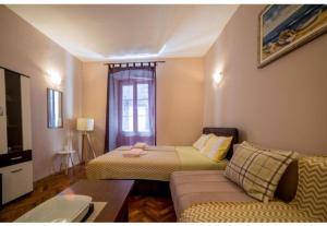Postel nebo postele na pokoji v ubytování Perast apartman "Mika"
