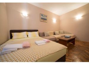 Postel nebo postele na pokoji v ubytování Perast apartman "Mika"