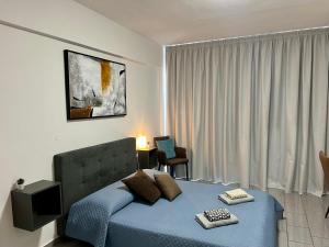 Katil atau katil-katil dalam bilik di FatCow Seaside Suites