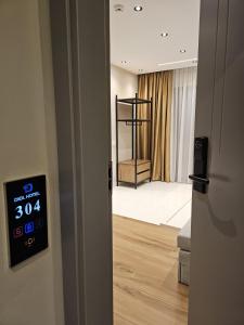 an open door to a room with a bedroom at Diol Hotel Ksamil in Ksamil
