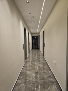 a corridor of an office building with a hallway at Diol Hotel Ksamil in Ksamil