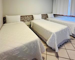 Postel nebo postele na pokoji v ubytování Porty Brasil Hotel