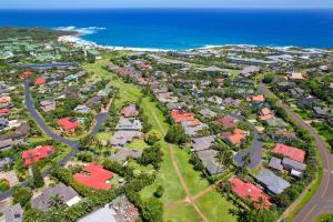 an aerial view of a suburb with houses and the ocean at Aston At Poipu Kai in Koloa