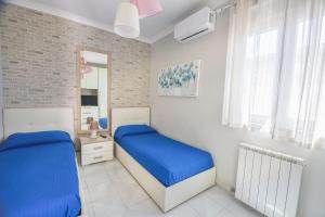 Postel nebo postele na pokoji v ubytování Miramare Fiumicino + 23 fotografií