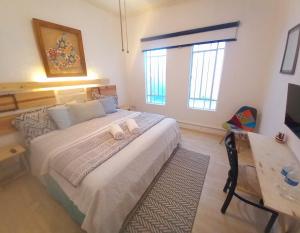 En eller flere senge i et værelse på CONDESA Host 3