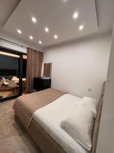 a bedroom with a bed and a dining room at Casa Amor in Neum