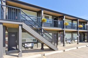 a building with a staircase on the side of it at Centro Motel in Calgary
