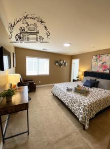 a bedroom with a bed and a sign on the wall at Bella's sweet house 5640 in Eastvale