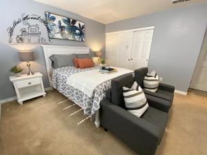 a bedroom with a bed and a couch at Bella's sweet house 5640 in Eastvale