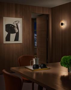 a dining room table with a plate and a picture at ModernHaus SoHo in New York