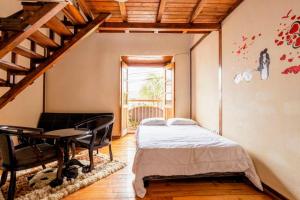 Ένα ή περισσότερα κρεβάτια σε δωμάτιο στο Hostal La Suite