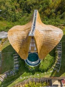 an aerial view of a building with a bridge at Villa Grazia - Anima Eco Lodge -Ville Lussuose con Piscina Vista Mare in Selong Belanak