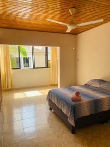 a bedroom with a bed and a ceiling fan at Paraiso Pie de la Popa in Cartagena de Indias +75 photos