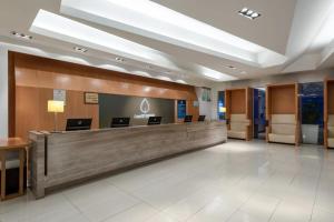 a lobby of a hospital with a reception desk at LeafIN Hotel Beijing Minzuyuan l Bird's Nest in Beijing
