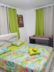 Postel nebo postele na pokoji v ubytování Villa goyavier