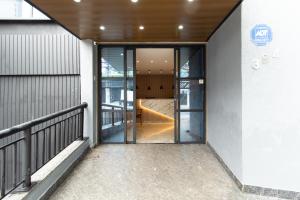 an open door of a building with a staircase at Hotel Villa Jequitibá in Sao Paulo
