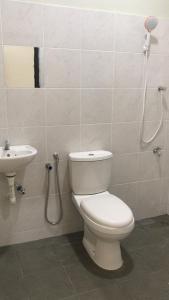 a bathroom with a toilet and a sink at Zaz cottage Langkawi in Pantai Cenang