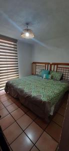 Postel nebo postele na pokoji v ubytování hermosa casa en ajijic con alberca CLIMATIZADA + 5 fotografií
