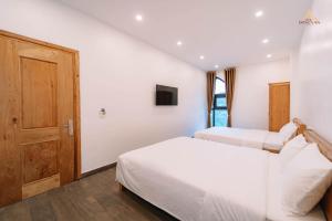 Voodi või voodid majutusasutuse Epic Đồng Văn Hotel toas