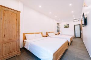Voodi või voodid majutusasutuse Epic Đồng Văn Hotel toas